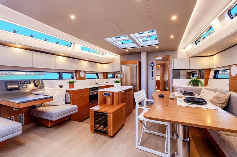 Slide: The Image of Luxurious interior of 2026 Hanse 590 yacht with modern kitchen and dining area. - 5
