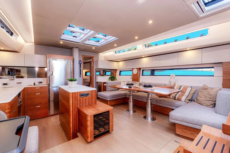 Slide: The Image of Luxurious interior of 2026 Hanse 590 yacht with modern design and spacious seating area. - 8