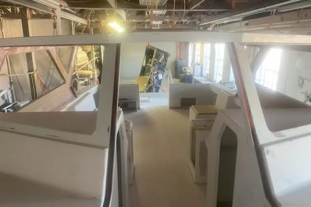 Slide: The Image of 2027 Compmillenia Lightspeed Tender under construction in a workshop setting. - 8