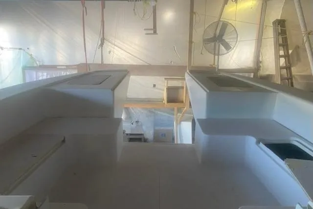 Slide: The Image of 2027 Compmillenia Lightspeed Tender under construction in a workshop setting. - 9