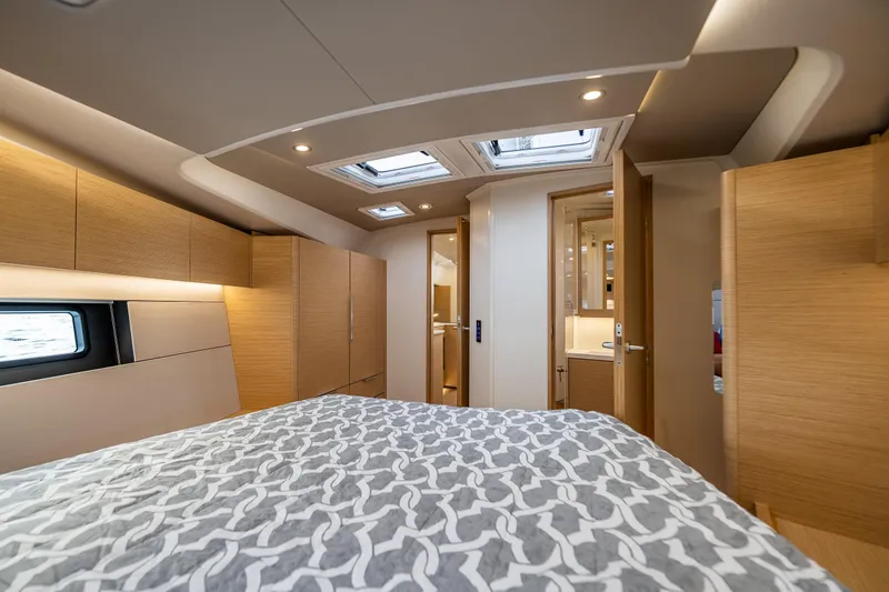 Slide: The Image of Luxurious interior of 2025 Hanse 460 yacht with modern wood finishes and skylights. - 24