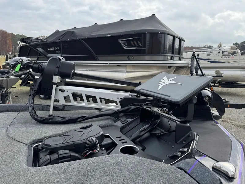 Slide: The Image of 2024 Skeeter FXR20 Limited Bass boat with advanced trolling motor and control panel. - 2