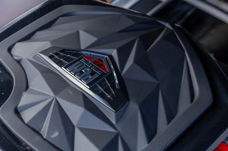 Slide: The Image of Close-up of 2023 Nautique Ski Nautique engine cover with PCM branding. - 9