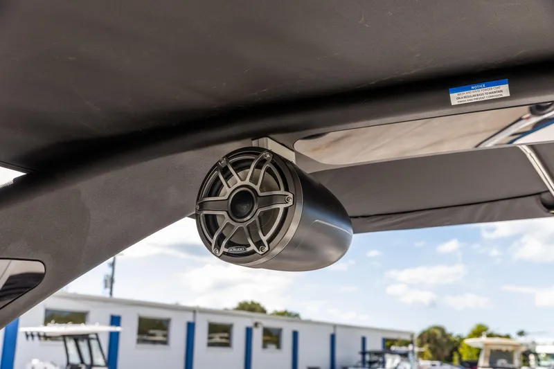 Slide: The Image of Speaker mounted on Viaggio Diamante Q 2026 boat, under a canopy with blue sky background. - 15