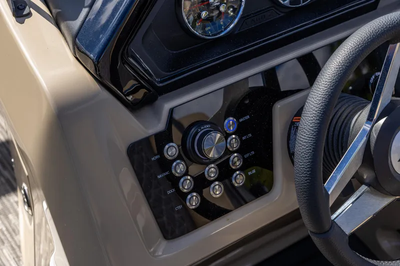Slide: The Image of Control panel of 2026 Viaggio Lago Z-S boat with steering wheel and buttons. - 12