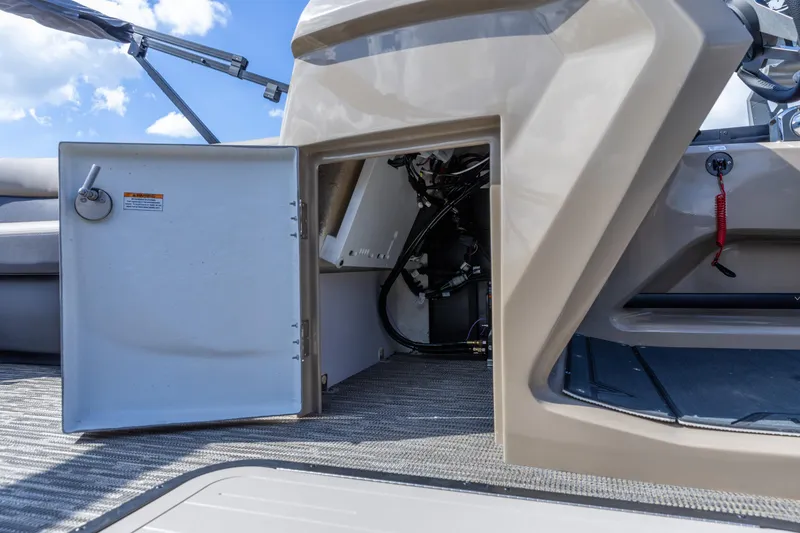 Slide: The Image of Open storage compartment on 2026 Viaggio Lago Z-S boat, showcasing interior details and wiring. - 16