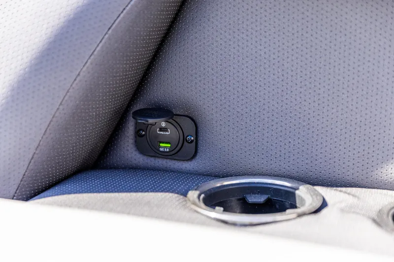 Slide: The Image of Car interior with USB charging port and cup holder in 2026 Viaggio Lago X-U. - 13