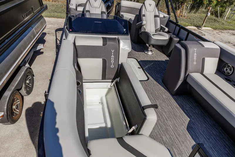 Slide: The Image of 2026 Viaggio Lago X-U boat interior with open storage compartment and seating. - 16