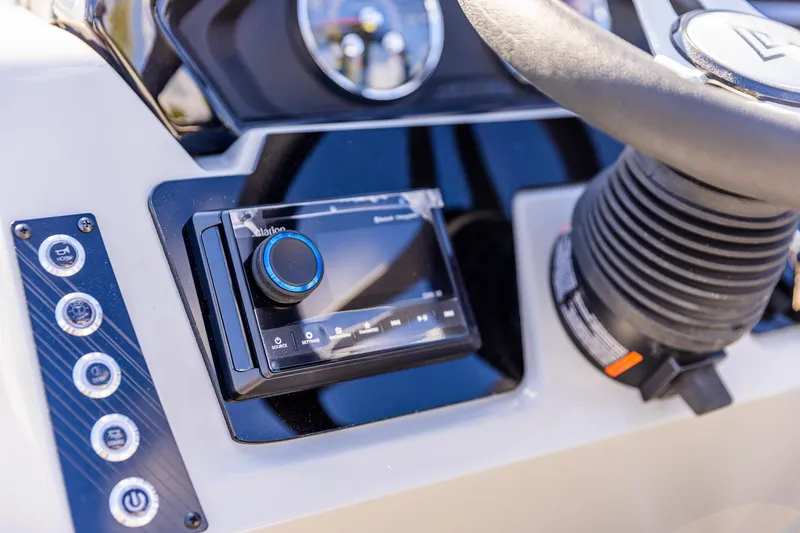 Slide: The Image of Control panel of 2026 Viaggio Lago X-U boat with steering wheel and audio system. - 20