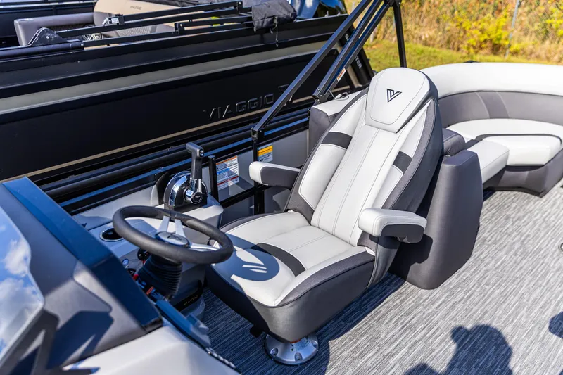 Slide: The Image of Captain's seat and steering of 2026 Viaggio Lago X-U boat, featuring modern design and controls. - 6