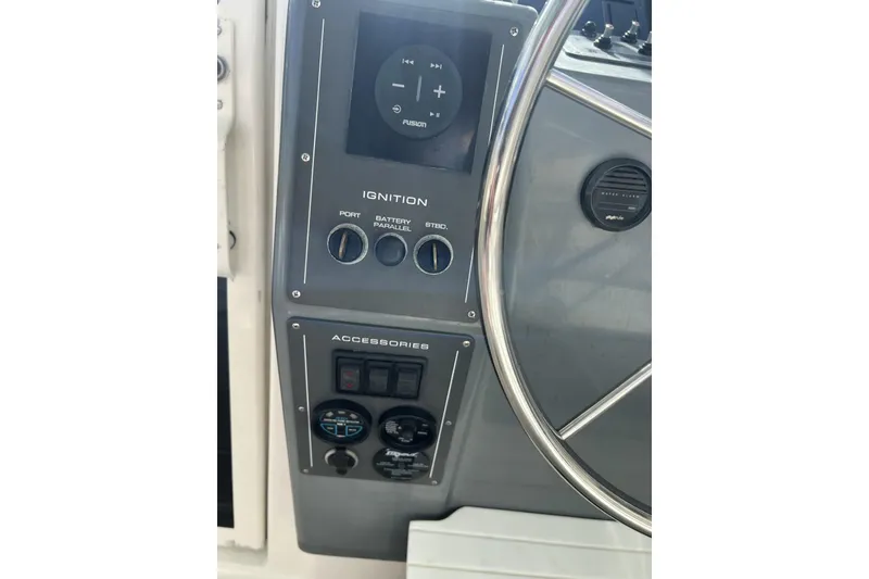 Slide: The Image of 1995 Tiara Yachts 3100 Open helm controls and ignition panel. - 10