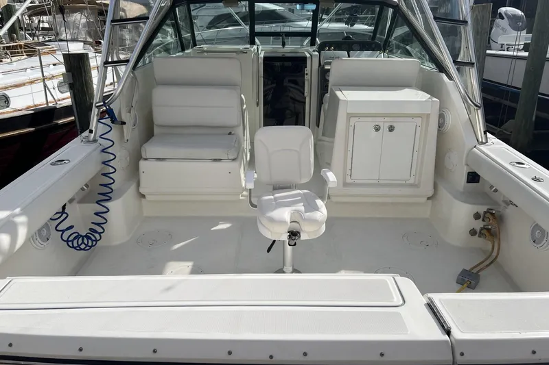 Slide: The Image of 1995 Tiara Yachts 3100 Open boat interior with seating and storage. - 13