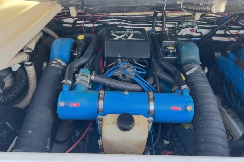 Slide: The Image of Engine compartment of a 1995 Tiara Yachts 3100 Open, featuring Crusader XL engine. - 21
