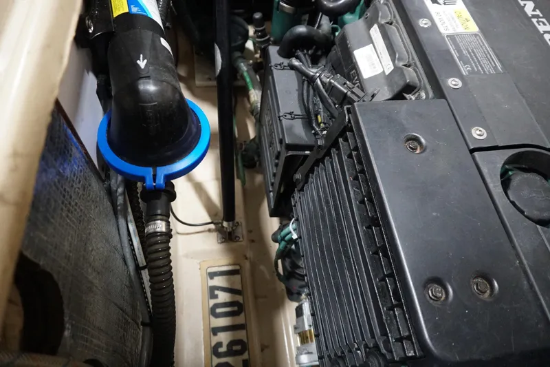 Slide: The Image of Engine compartment of a 2013 Ranger Tugs S-31 boat, showcasing mechanical components. - 10