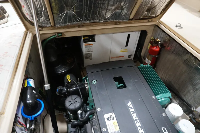 Slide: The Image of Engine compartment of 2013 Ranger Tugs S-31 with Volvo Penta engine and fire extinguisher. - 11