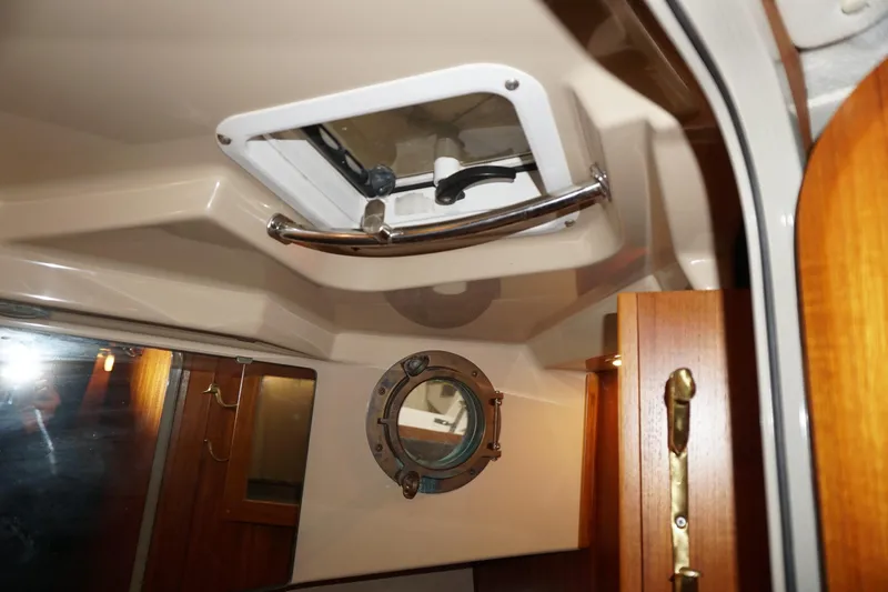 Slide: The Image of Interior of 2013 Ranger Tugs S-31 boat showing hatch and porthole details. - 21