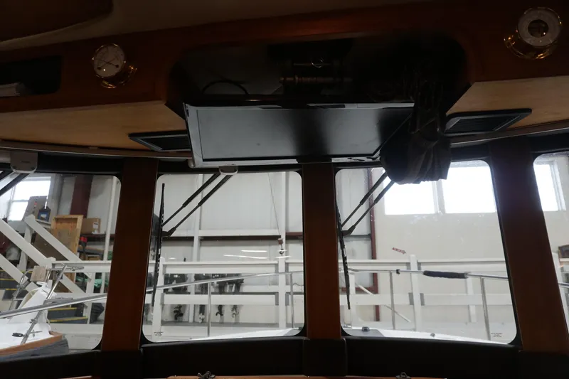 Slide: The Image of Interior view of 2013 Ranger Tugs S-31 boat with windows and equipment. - 24