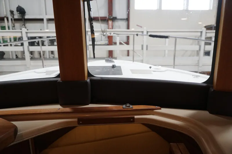 Slide: The Image of Interior view from a 2013 Ranger Tugs S-31 boat, showcasing the helm area. - 25