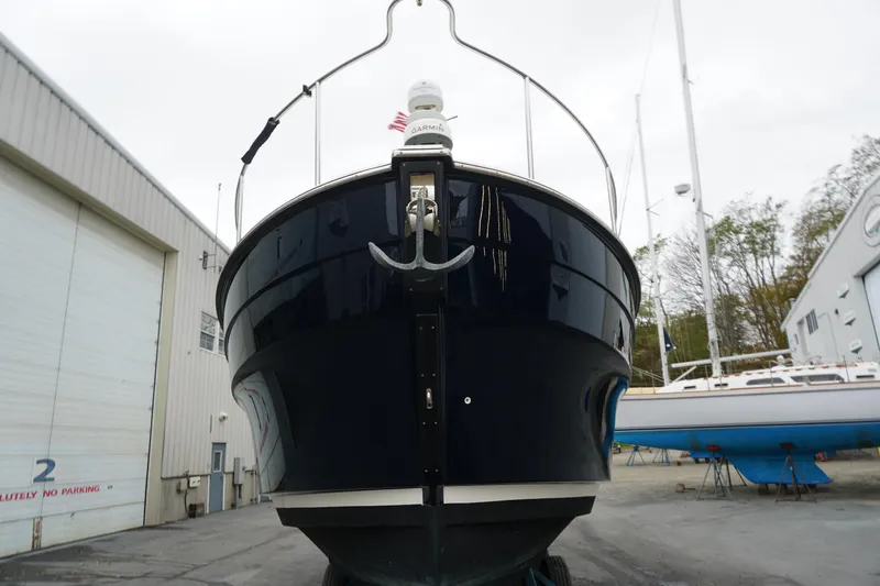 Slide: The Image of 2013 Ranger Tugs S-31 boat in a shipyard, front view. - 3