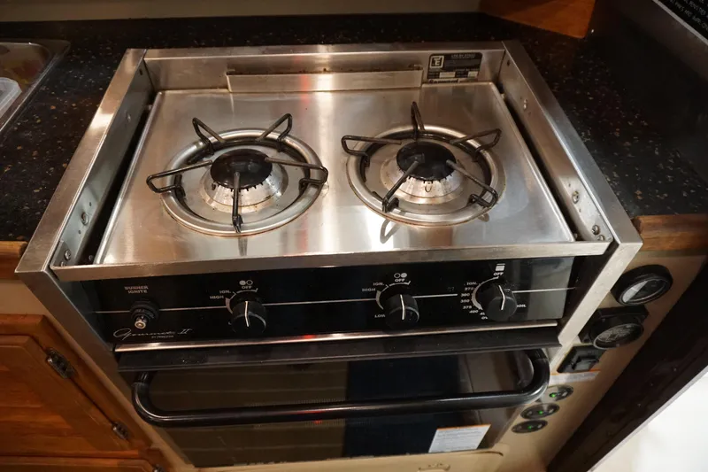 Slide: The Image of Stainless steel two-burner stove in 2013 Ranger Tugs S-31 boat kitchen. - 30