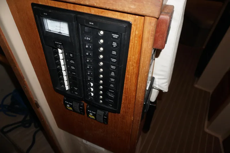 Slide: The Image of Electrical panel on 2013 Ranger Tugs S-31 boat, featuring switches and controls. - 31