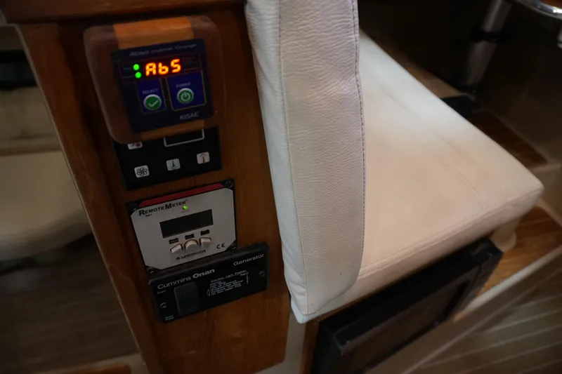 Slide: The Image of Control panel and seating inside a 2013 Ranger Tugs S-31 boat. - 32