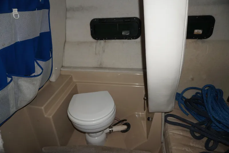 Slide: The Image of 2013 Ranger Tugs S-31 boat interior with toilet and storage area. - 47