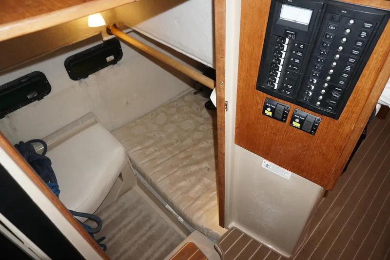 Slide: The Image of 2013 Ranger Tugs S-31 cabin interior with control panel and sleeping area. - 48