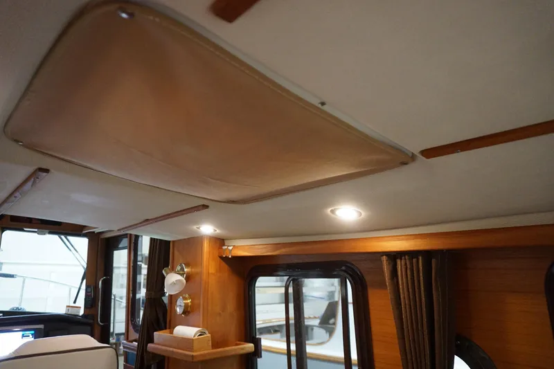 Slide: The Image of Interior of 2013 Ranger Tugs S-31 boat with wood accents and lighting. - 51