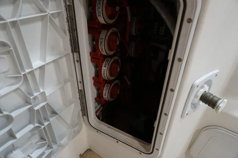 Slide: The Image of 2013 Ranger Tugs S-31 battery compartment with labeled switches for engine and thrusters. - 53