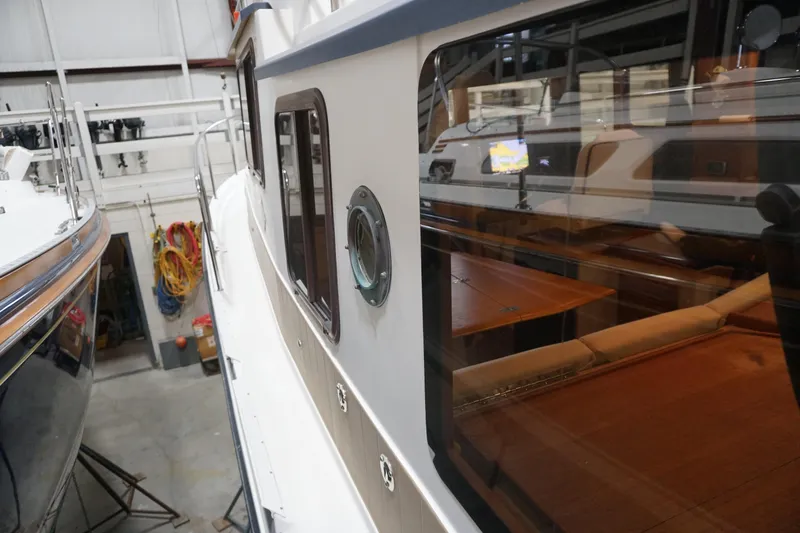 Slide: The Image of 2013 Ranger Tugs S-31 boat interior view in a storage facility. - 57
