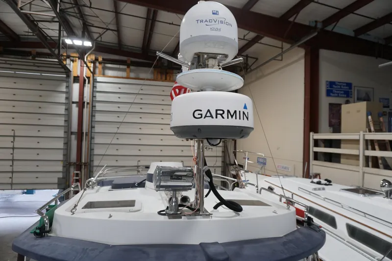 Slide: The Image of 2013 Ranger Tugs S-31 with Garmin and TracVision equipment in a boat storage facility. - 61