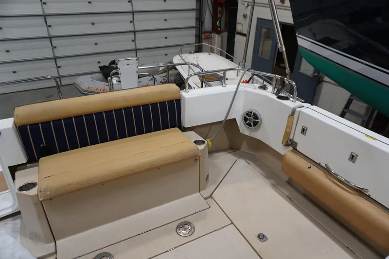 Slide: The Image of 2013 Ranger Tugs S-31 boat interior with seating and storage in a garage. - 64