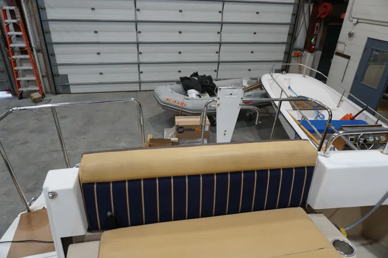 Slide: The Image of 2013 Ranger Tugs S-31 boat interior in a garage with additional equipment. - 65