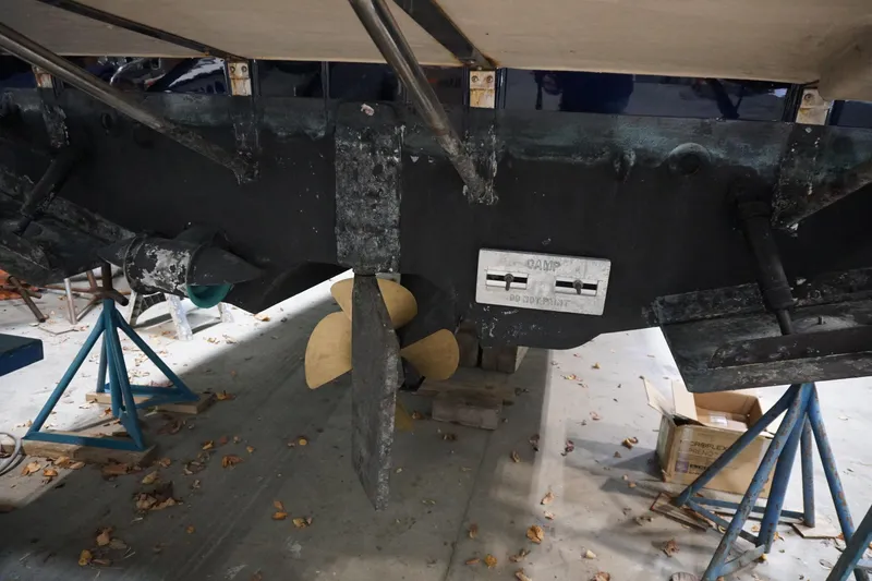 Slide: The Image of 2013 Ranger Tugs S-31 boat propeller and rudder in dry dock. - 67