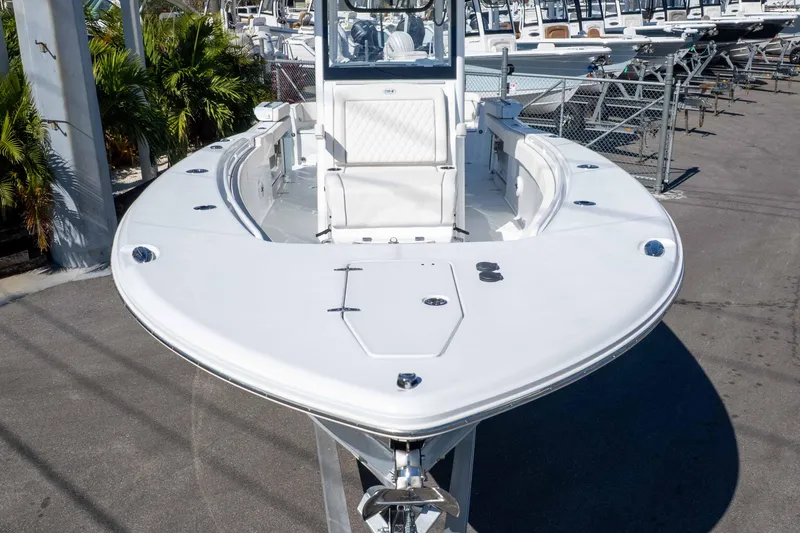 Slide: The Image of 2026 Sea Hunt Ultra 285 SE boat displayed in a marina setting. - 15