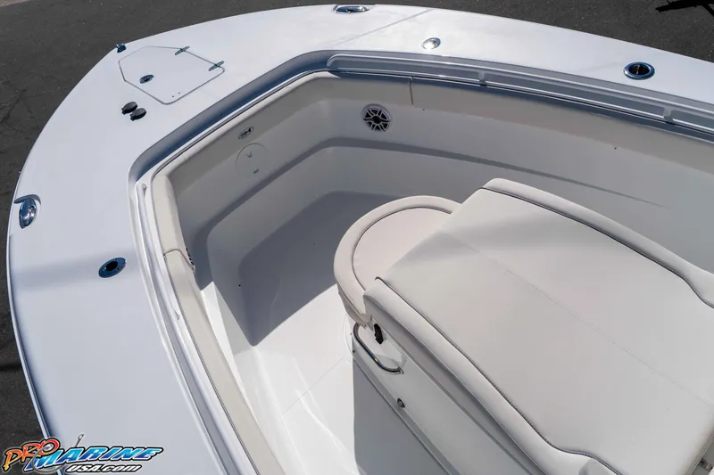 Slide: The Image of 2026 Sea Hunt Ultra 285 SE boat interior with cushioned seating and storage. - 16