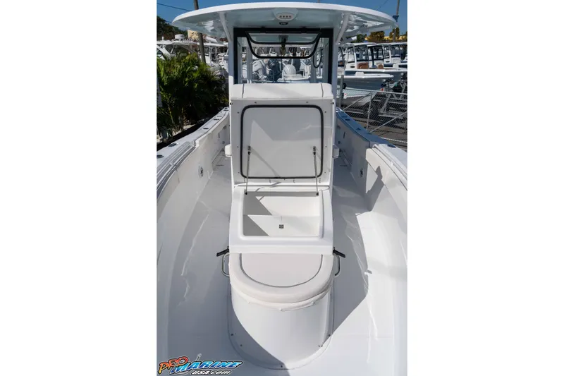 Slide: The Image of 2026 Sea Hunt Ultra 285 SE boat interior with open storage compartment. - 18