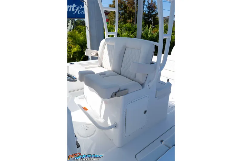 Slide: The Image of 2026 Sea Hunt Ultra 285 SE boat seat with white cushioned design and armrests. - 25