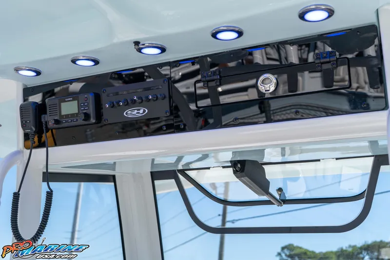 Slide: The Image of 2026 Sea Hunt Ultra 285 SE boat console with modern electronics and lighting. - 28