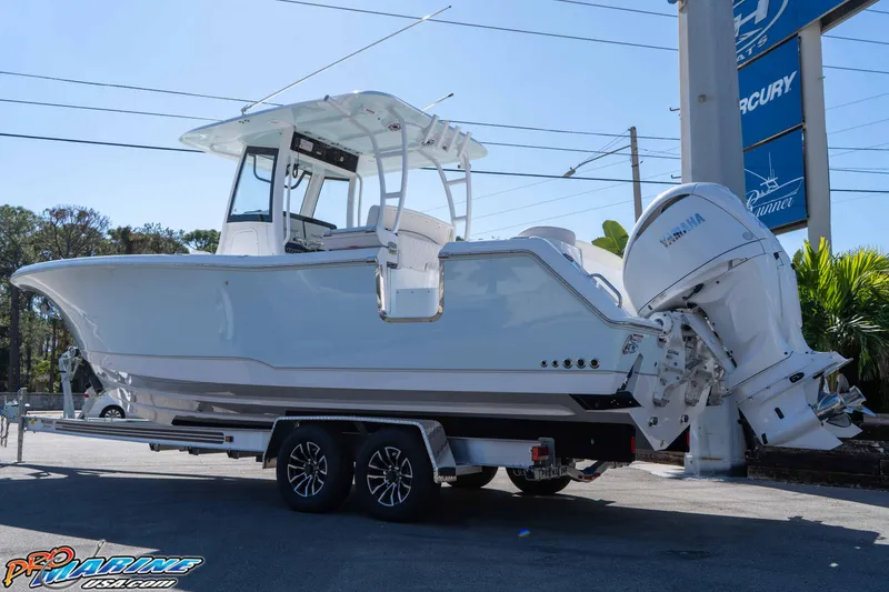 Slide: The Image of 2026 Sea Hunt Ultra 285 SE boat on trailer with Yamaha outboard engines. - 4