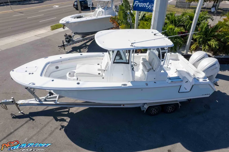 Slide: The Image of 2026 Sea Hunt Ultra 285 SE boat on trailer, displayed outdoors. - 5