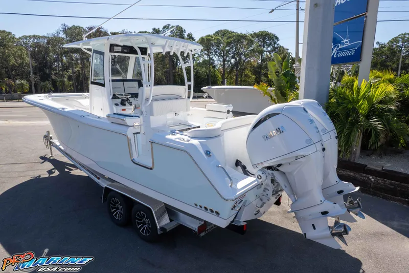 Slide: The Image of 2026 Sea Hunt Ultra 285 SE boat with dual Yamaha engines on a trailer. - 6