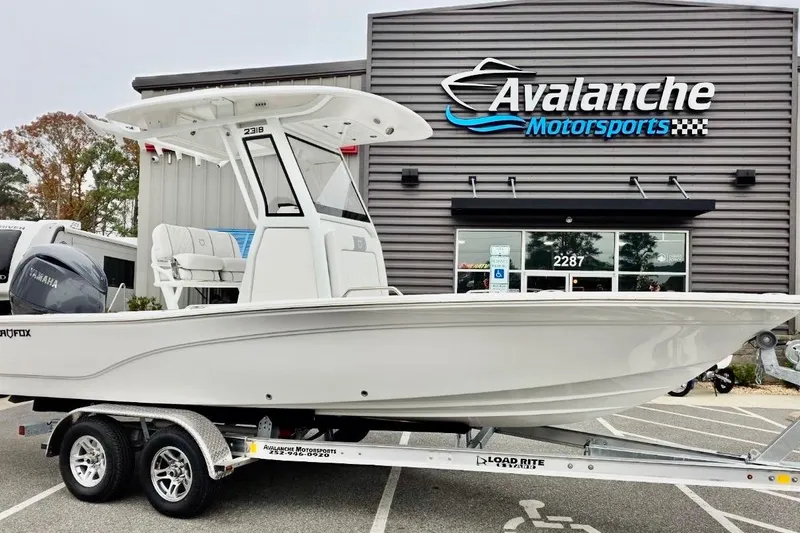 The Image of 2026 Sea Fox 231 Bay Fox boat on trailer at Avalanche Motorsports dealership. - 1