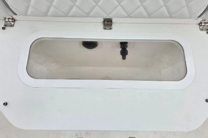 Slide: The Image of Livewell compartment on a 2026 Sea Fox 231 Bay Fox boat, featuring a clear lid. - 10