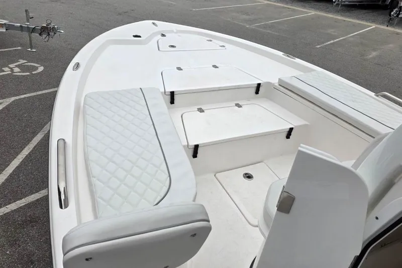 Slide: The Image of 2026 Sea Fox 231 Bay Fox boat interior with cushioned seating and storage compartments. - 12