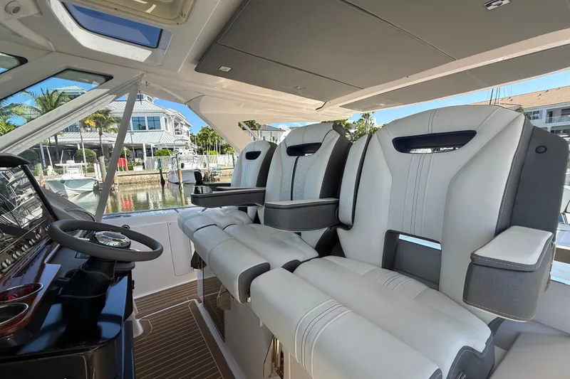 Slide: The Image of 2019 Tiara Sport 38 LS boat interior with luxurious seating and modern helm. - 10