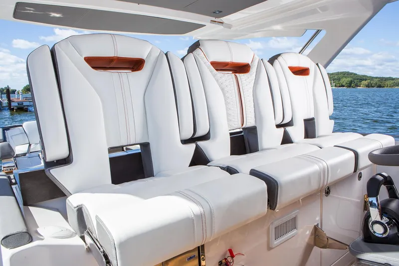 Slide: The Image of Manufacturer Provided Image: Luxurious seating on the 2019 Tiara Sport 38 LS boat with scenic water backdrop. - 11