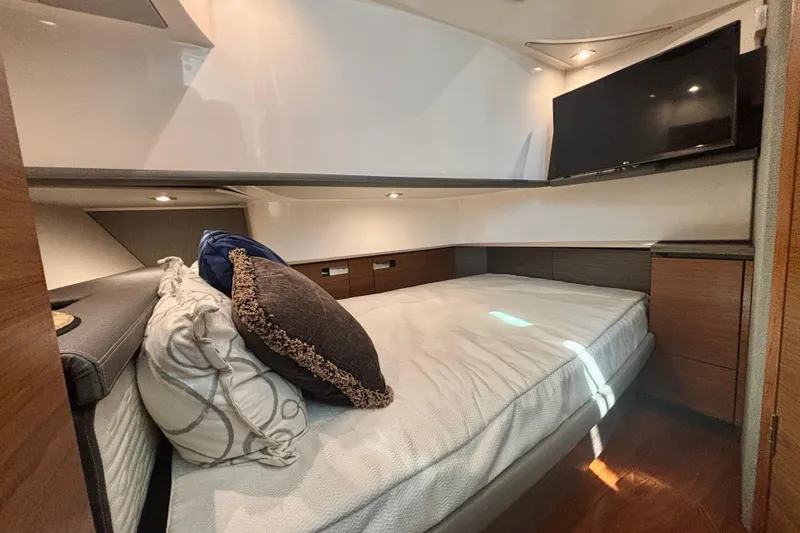 Slide: The Image of Luxurious cabin interior of 2019 Tiara Sport 38 LS with cozy bedding and TV. - 24