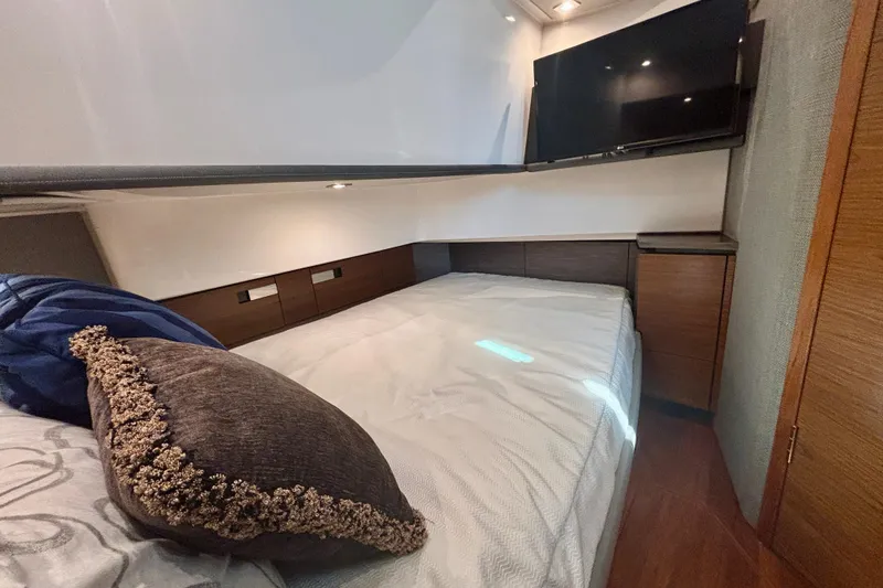 Slide: The Image of Luxurious cabin interior of 2019 Tiara Sport 38 LS yacht with bed and TV. - 25